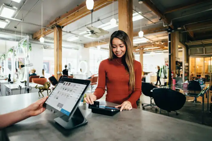Small business owner serving a customer